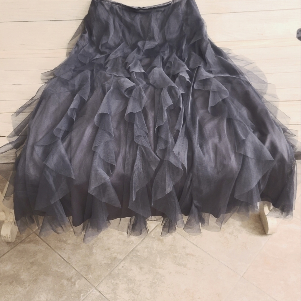 A full-length "Evening Skirt" has sheer vertical ruffles. It's an eye catcher.